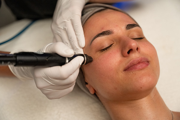 woman relaxing during HydraFacial skincare service