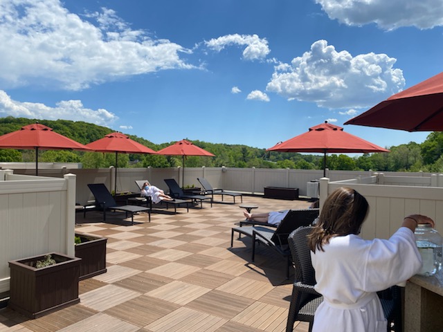 Guests relaxing on the rooftop garden of Oasis Westchester